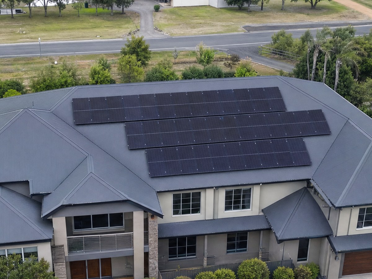 Solar array on a dark tile roof, aerial view